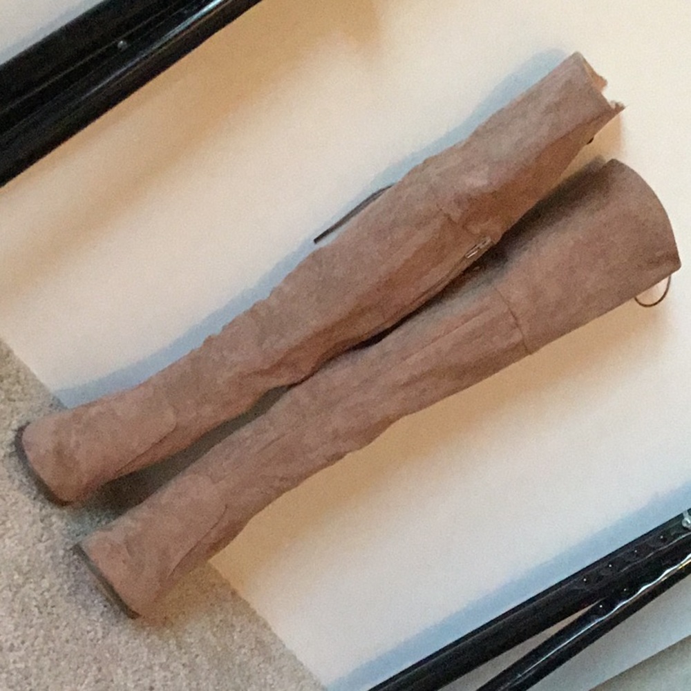 Brown knee high heeled boots